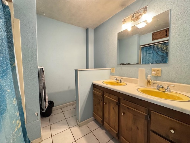 7792 Bubbling Springs Rd, Harrison, AR 72601 - full bathroom featuring tile patterned floors, double vanity, a textured wall, and a textured ceiling
