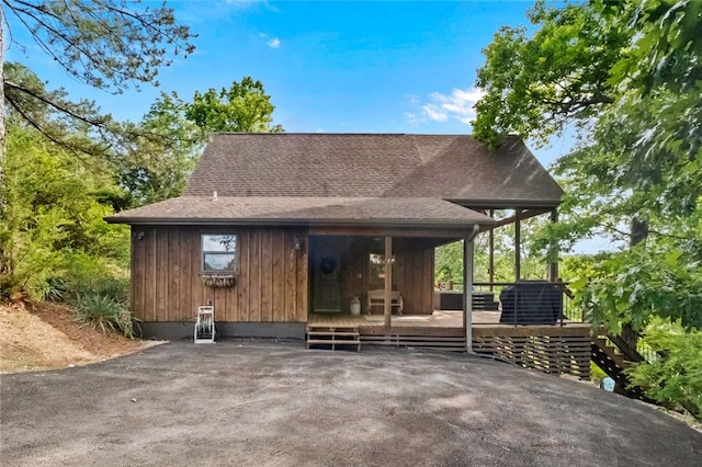 8715 Rambo N Rd, Rogers, AR 72756 - rear view of property featuring a shingled roof and a deck