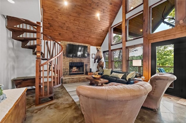 8715 Rambo N Rd, Rogers, AR 72756 - living room featuring stairway, finished concrete floors, high vaulted ceiling, a fireplace, and wood ceiling