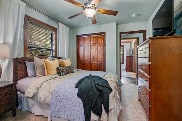 8715 Rambo N Rd, Rogers, AR 72756 - bedroom with carpet floors, a closet, and a ceiling fan