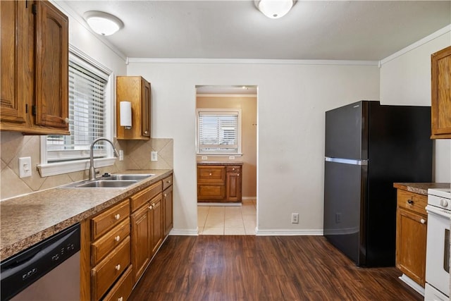 520 S 13th St, Rogers, AR 72758 - kitchen featuring stainless steel dishwasher, freestanding refrigerator, plenty of natural light, brown cabinets, and ornamental molding