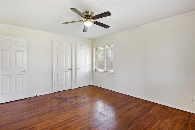 520 S 13th St, Rogers, AR 72758 - unfurnished bedroom featuring wood finished floors, multiple closets, crown molding, and ceiling fan