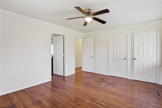 520 S 13th St, Rogers, AR 72758 - unfurnished bedroom featuring wood finished floors, ornamental molding, and ceiling fan