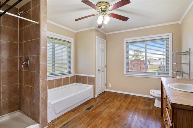 520 S 13th St, Rogers, AR 72758 - bathroom with vanity, a bath, hardwood / wood-style flooring, a tile shower, and crown molding