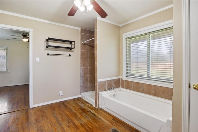 520 S 13th St, Rogers, AR 72758 - bathroom featuring ceiling fan, a bath, wood finished floors, crown molding, and tiled shower