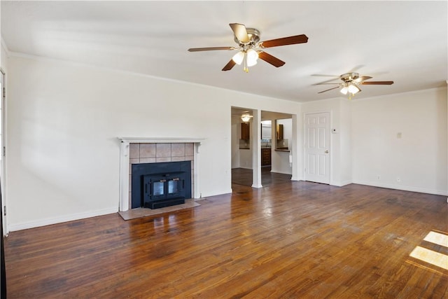 520 S 13th St, Rogers, AR 72758 - unfurnished living room featuring ceiling fan, wood finished floors, a tile fireplace, and crown molding