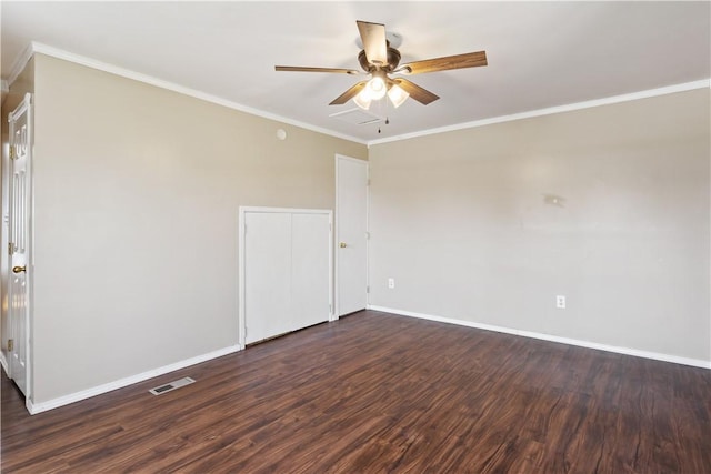 520 S 13th St, Rogers, AR 72758 - spare room featuring ceiling fan, dark wood-type flooring, and ornamental molding