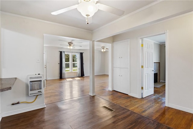 520 S 13th St, Rogers, AR 72758 - unfurnished living room with heating unit, wood finished floors, ornamental molding, and a ceiling fan