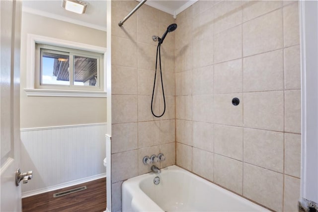 520 S 13th St, Rogers, AR 72758 - bathroom with shower / bath combination, wood finished floors, a wainscoted wall, and ornamental molding