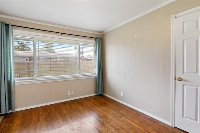 520 S 13th St, Rogers, AR 72758 - spare room featuring healthy amount of natural light, wood finished floors, and crown molding