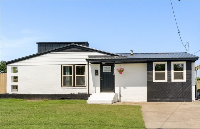 520 S 13th St, Rogers, AR 72758 - view of front of property featuring a metal roof and concrete driveway