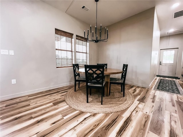 5807 Farm Rd Unit 2212, Washburn, MO 65772 - dining area featuring wood finished floors, a chandelier, and attic access