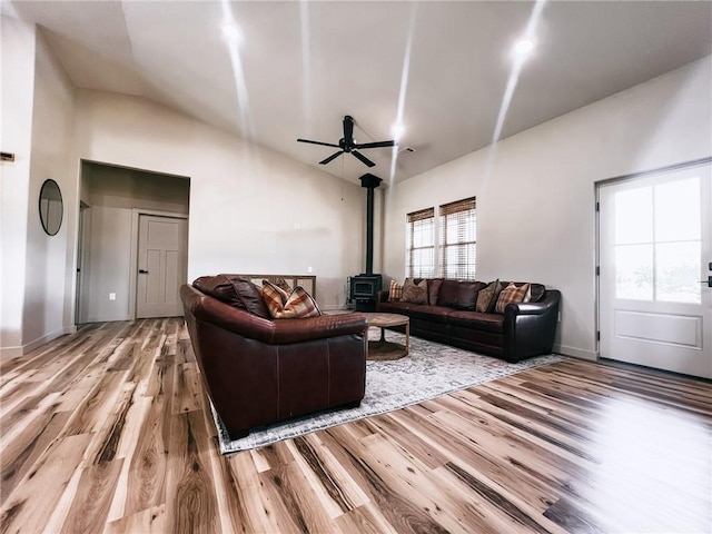 5807 Farm Rd Unit 2212, Washburn, MO 65772 - living room featuring wood finished floors, a wood stove, lofted ceiling, and a ceiling fan