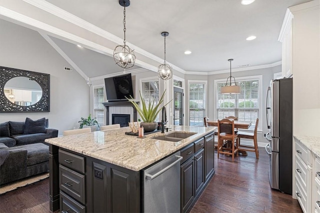 5208 43rd St, Rogers, AR 72758 - kitchen with stainless steel appliances, open floor plan, white cabinets, dark wood-style flooring, and lofted ceiling