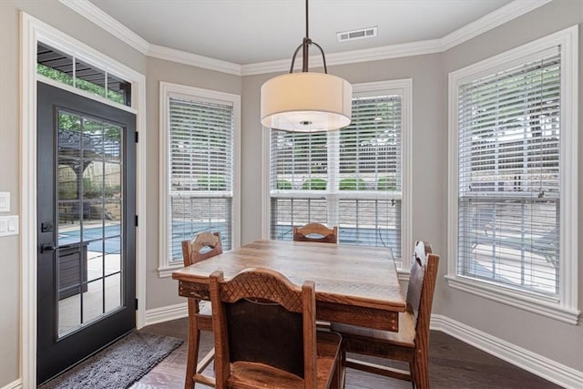 5208 43rd St, Rogers, AR 72758 - dining area with dark wood finished floors and crown molding