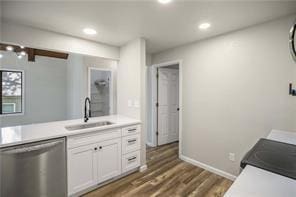 26 Norwood Dr, Bella Vista, AR 72714 - kitchen with dishwasher, light countertops, dark wood-style flooring, white cabinets, and recessed lighting