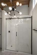 26 Norwood Dr, Bella Vista, AR 72714 - bathroom featuring a chandelier and a stall shower