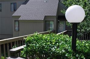 26 Norwood Dr, Bella Vista, AR 72714 - view of side of property featuring a shingled roof