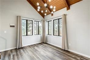 26 Norwood Dr, Bella Vista, AR 72714 - empty room with a chandelier, healthy amount of natural light, a wood ceiling with exposed beams, wood finished floors, and high vaulted ceiling