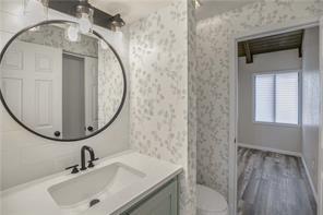26 Norwood Dr, Bella Vista, AR 72714 - full bath with vanity, wallpapered walls, and wood finished floors