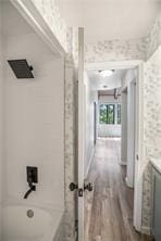 26 Norwood Dr, Bella Vista, AR 72714 - hallway featuring wood finished floors and wallpapered walls