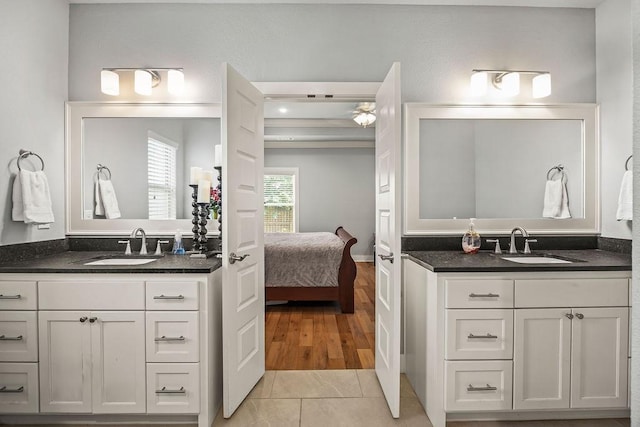 4609 W Waters Edge Dr, Rogers, AR 72758 - full bathroom with ensuite bath, two vanities, and tile patterned flooring