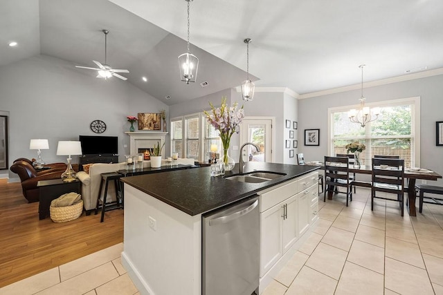 4609 W Waters Edge Dr, Rogers, AR 72758 - kitchen with dishwasher, light tile patterned floors, a chandelier, white cabinetry, and decorative light fixtures