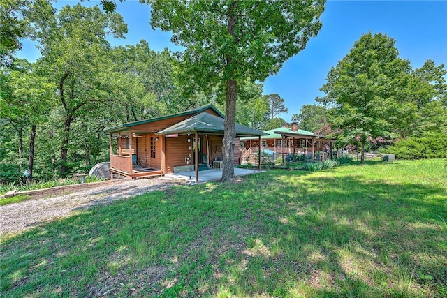 8092 Fain Dr, Rogers, AR 72756 - rear view of house featuring a yard