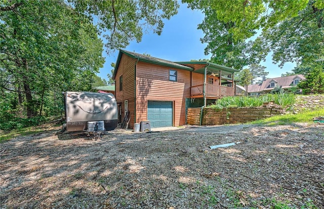 8092 Fain Dr, Rogers, AR 72756 - back of house featuring an attached garage