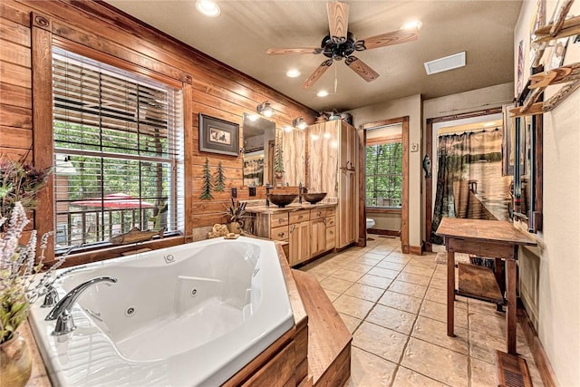 8092 Fain Dr, Rogers, AR 72756 - full bathroom featuring vanity, a tub with jets, tile patterned floors, wooden walls, and ceiling fan
