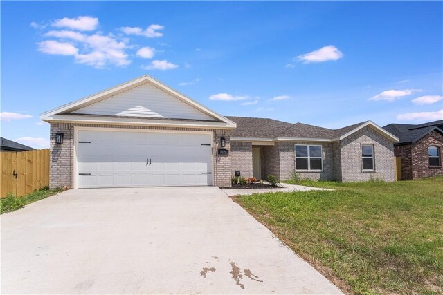 4669 W Triangle St, Fayetteville, AR 72704 - ranch-style house with driveway, brick siding, and an attached garage