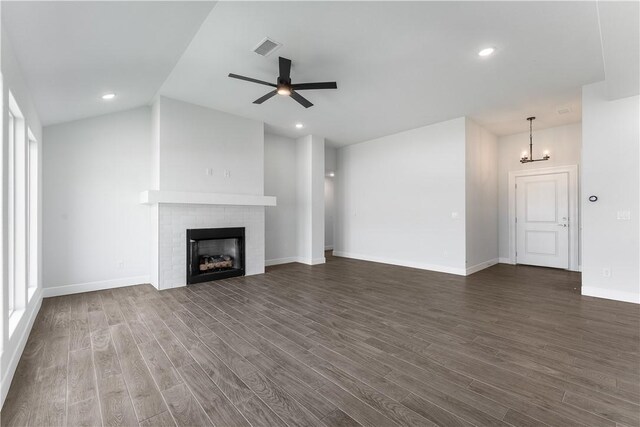 4669 W Triangle St, Fayetteville, AR 72704 - unfurnished living room featuring dark wood finished floors, a fireplace, ceiling fan, recessed lighting, and a chandelier