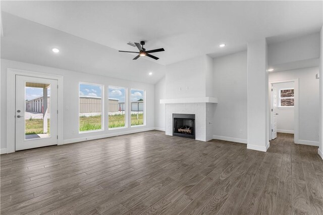 4669 W Triangle St, Fayetteville, AR 72704 - unfurnished living room featuring a brick fireplace, dark wood-style floors, a ceiling fan, recessed lighting, and lofted ceiling