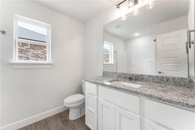 4669 W Triangle St, Fayetteville, AR 72704 - full bathroom with wood finished floors, vanity, and a shower