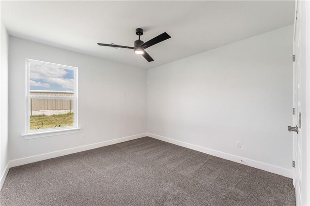 4669 W Triangle St, Fayetteville, AR 72704 - spare room with a ceiling fan and dark carpet