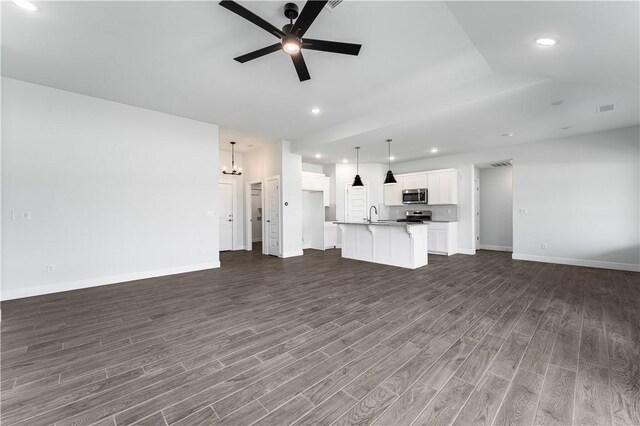 4669 W Triangle St, Fayetteville, AR 72704 - unfurnished living room with dark wood finished floors, a ceiling fan, and recessed lighting