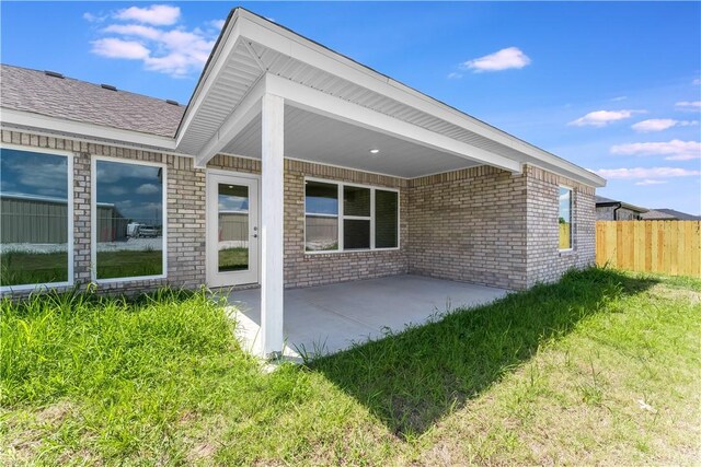 4669 W Triangle St, Fayetteville, AR 72704 - rear view of house featuring a patio and brick siding