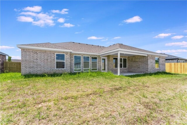 4669 W Triangle St, Fayetteville, AR 72704 - rear view of house featuring brick siding and a patio area