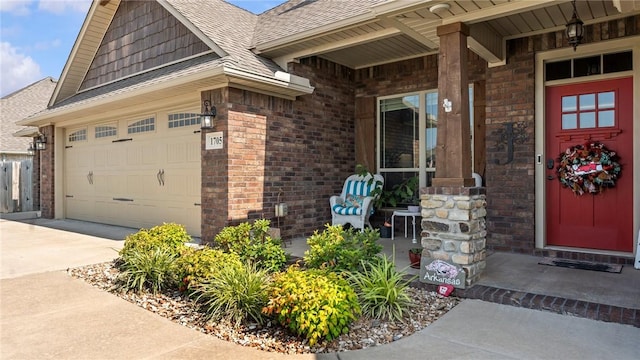 1705 Tull Dr, Pea Ridge, AR 72751 - property entrance featuring brick siding, driveway, roof with shingles, an attached garage, and covered porch