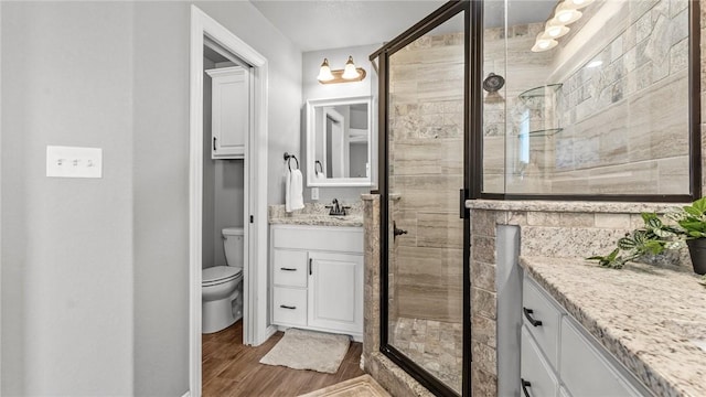 1705 Tull Dr, Pea Ridge, AR 72751 - full bath with vanity, a shower stall, and wood finished floors