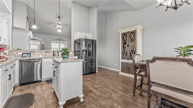 1705 Tull Dr, Pea Ridge, AR 72751 - kitchen featuring stainless steel appliances, a chandelier, white cabinetry, backsplash, and hanging light fixtures