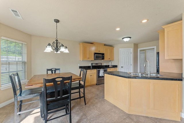 1315 S Breckenridge Loop, Rogers, AR 72756 - kitchen with stainless steel range with electric stovetop, light brown cabinetry, dark countertops, a peninsula, and a chandelier