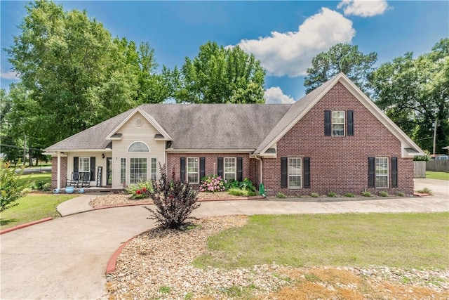 3 Jared Ln, Conway, AR 72032 - view of front of house featuring brick siding, a front lawn, and a shingled roof