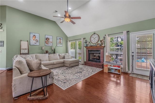 3 Jared Ln, Conway, AR 72032 - living room with a ceiling fan, plenty of natural light, wood finished floors, high vaulted ceiling, and a brick fireplace