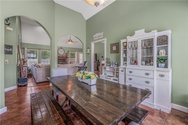 3 Jared Ln, Conway, AR 72032 - dining space with high vaulted ceiling, arched walkways, a ceiling fan, and tile patterned flooring