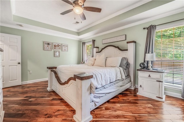 3 Jared Ln, Conway, AR 72032 - bedroom with multiple windows, a raised ceiling, ornamental molding, dark wood-style floors, and a ceiling fan
