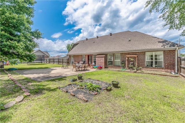 3 Jared Ln, Conway, AR 72032 - rear view of property featuring brick siding, a fenced backyard, a patio area, and roof with shingles