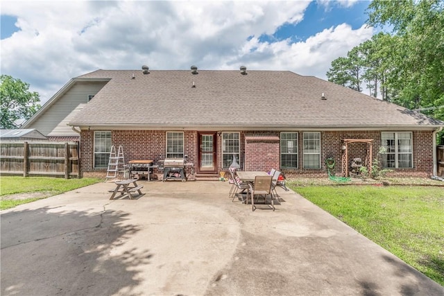 3 Jared Ln, Conway, AR 72032 - rear view of property featuring brick siding, a patio, and roof with shingles