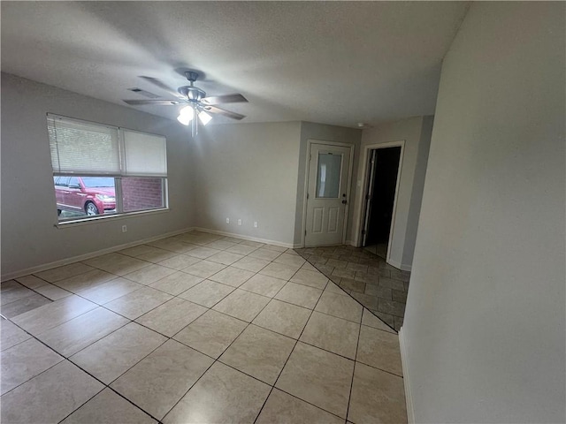 1010 Tori Ln, Beebe, AR 72012 - spare room with light tile patterned floors and a ceiling fan