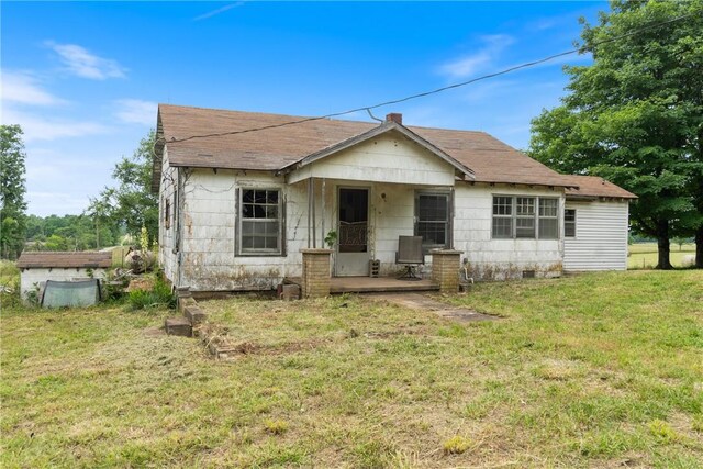640 Madison Unit 4036, Huntsville, AR 72959 - view of front of home with a front lawn, a shingled roof, and crawl space